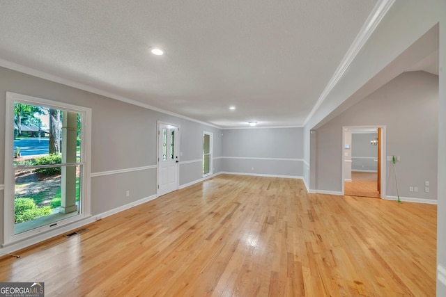 112 White Oak Cir, Dublin, GA 31021 - unfurnished living room featuring ornamental molding, light wood-style flooring, baseboards, and recessed lighting
