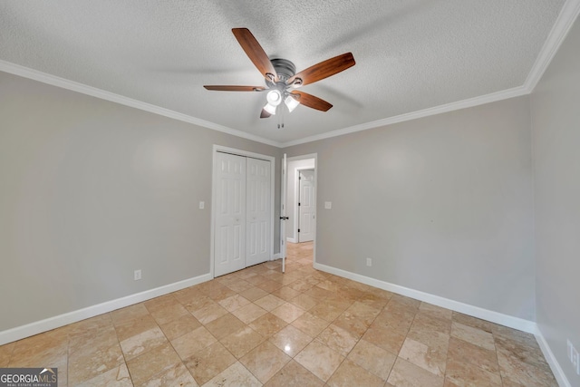 112 White Oak Cir, Dublin, GA 31021 - spare room with a ceiling fan, a textured ceiling, baseboards, ornamental molding, and light stone finish floors