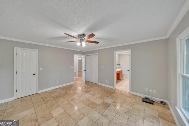 112 White Oak Cir, Dublin, GA 31021 - unfurnished bedroom with ornamental molding, baseboards, connected bathroom, a textured ceiling, and a ceiling fan
