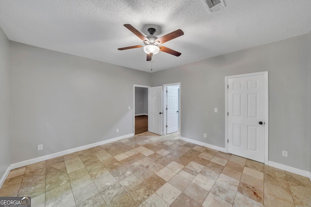 112 White Oak Cir, Dublin, GA 31021 - unfurnished bedroom featuring baseboards, a textured ceiling, and ceiling fan