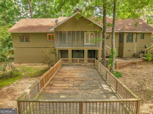 112 White Oak Cir, Dublin, GA 31021 - rear view of house with a sunroom, stairway, and roof with shingles