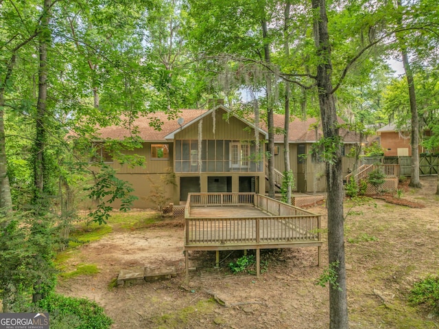 112 White Oak Cir, Dublin, GA 31021 - rear view of property featuring a sunroom, a deck, and roof with shingles