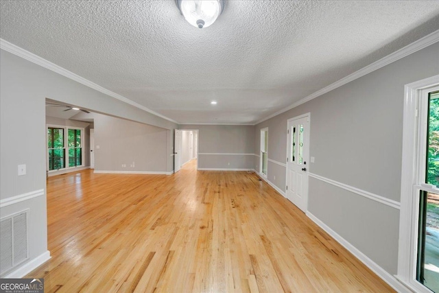 112 White Oak Cir, Dublin, GA 31021 - empty room with light wood finished floors, a textured ceiling, ornamental molding, and baseboards