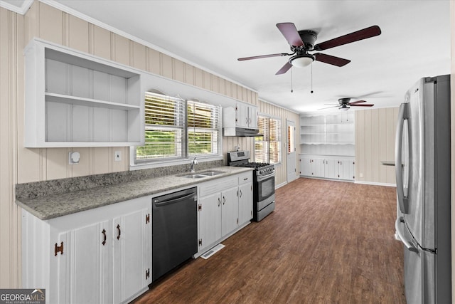 416 S Carroll Rd, Villa Rica, GA 30180 - kitchen featuring appliances with stainless steel finishes, a sink, under cabinet range hood, ornamental molding, and dark wood-style floors