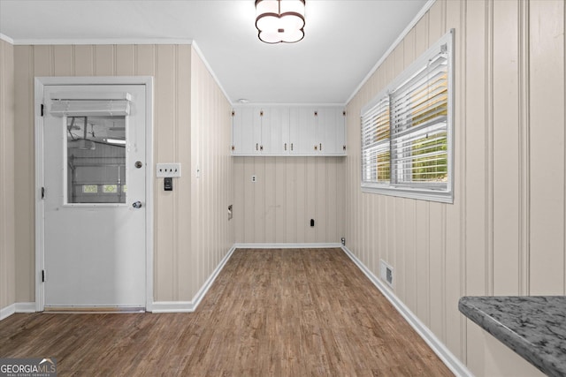 416 S Carroll Rd, Villa Rica, GA 30180 - laundry area with wood finished floors, crown molding, and baseboards