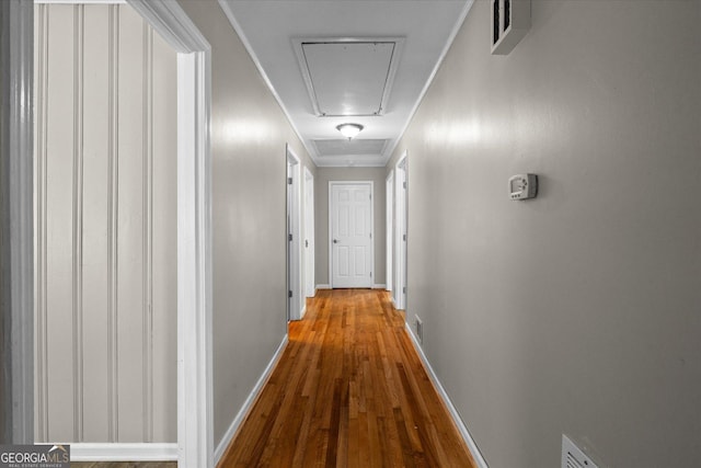 416 S Carroll Rd, Villa Rica, GA 30180 - hallway with attic access, wood finished floors, and baseboards