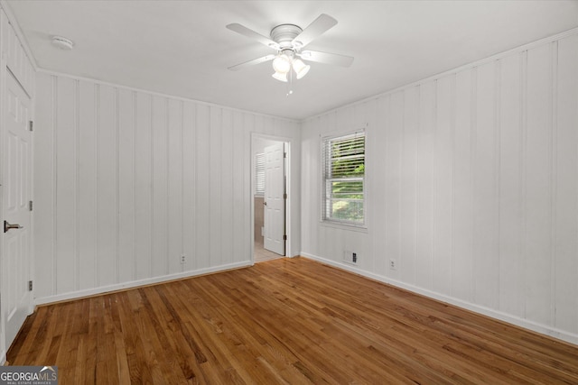 416 S Carroll Rd, Villa Rica, GA 30180 - unfurnished room with wood finished floors, a ceiling fan, baseboards, and a smoke detector