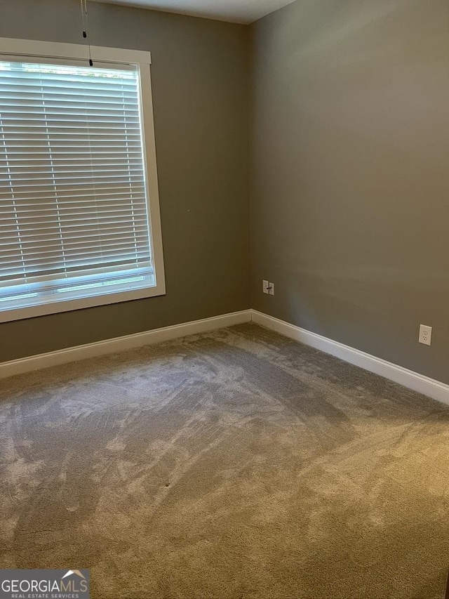 15785 Concord St, Zebulon, GA 30295 - carpeted empty room featuring baseboards