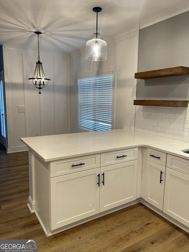 15785 Concord St, Zebulon, GA 30295 - kitchen with open shelves, a peninsula, white cabinetry, light countertops, and ornamental molding