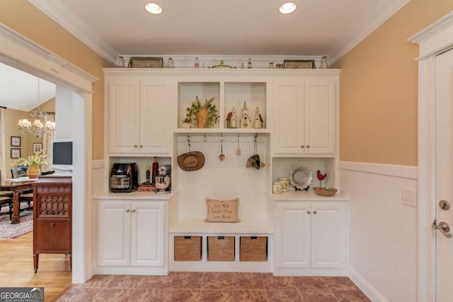 901 Providence Ln, Monroe, GA 30656 - mudroom with a chandelier, a wainscoted wall, crown molding, and recessed lighting