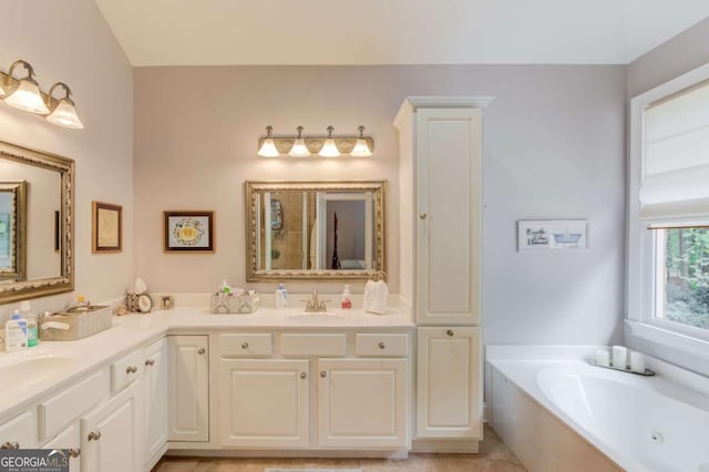 901 Providence Ln, Monroe, GA 30656 - bathroom with double vanity and a jetted tub