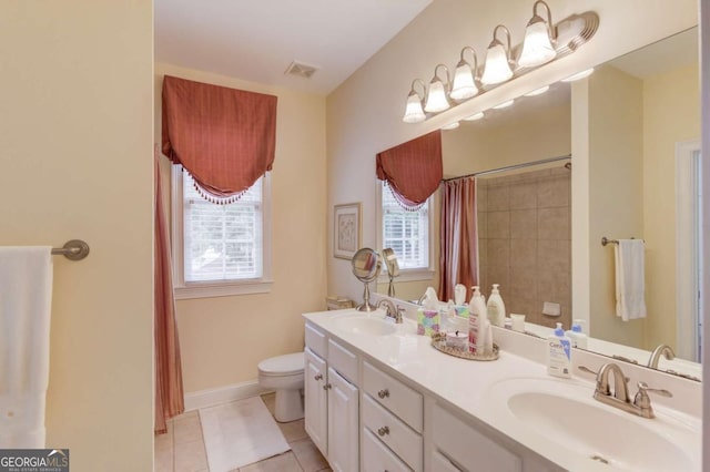 901 Providence Ln, Monroe, GA 30656 - full bath with toilet, double vanity, tile patterned flooring, a shower with shower curtain, and baseboards