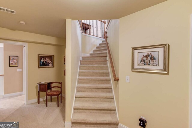 901 Providence Ln, Monroe, GA 30656 - staircase featuring carpet flooring and baseboards