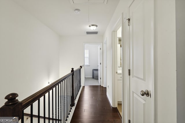 178 Munira Ln SW, South Fulton, GA 30331 - hall featuring attic access, dark wood finished floors, baseboards, and an upstairs landing