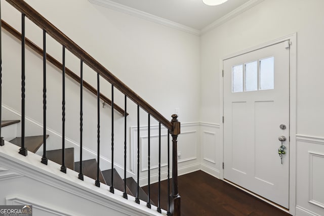 178 Munira Ln SW, South Fulton, GA 30331 - foyer featuring wood finished floors, crown molding, stairs, a decorative wall, and wainscoting