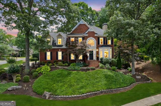 750 Highview Ct, Woodstock, GA 30189 - georgian-style home featuring brick siding, a chimney, and a front yard