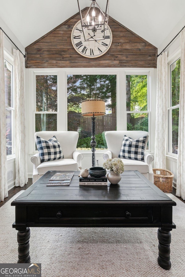 750 Highview Ct, Woodstock, GA 30189 - sunroom featuring a chandelier, high vaulted ceiling, and wooden walls