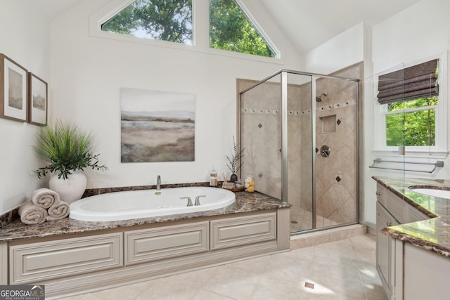 750 Highview Ct, Woodstock, GA 30189 - bathroom featuring a bath, vanity, a shower stall, plenty of natural light, and high vaulted ceiling
