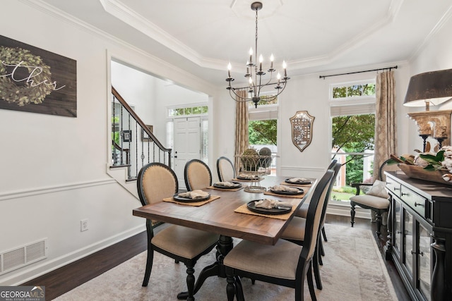 750 Highview Ct, Woodstock, GA 30189 - dining space with ornamental molding, healthy amount of natural light, wood finished floors, a chandelier, and a raised ceiling