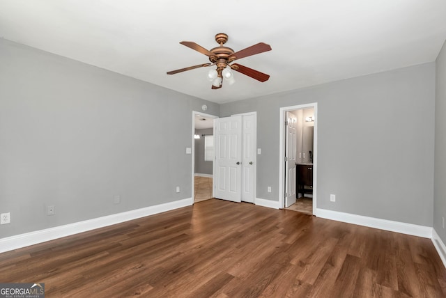 166 Walnut Cv, Dawsonville, GA 30534 - unfurnished bedroom featuring wood finished floors, baseboards, ensuite bath, and ceiling fan