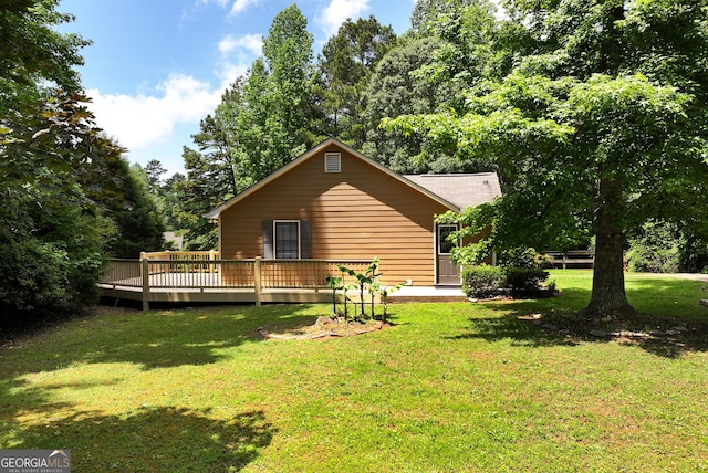 166 Walnut Cv, Dawsonville, GA 30534 - view of side of property with a deck, a yard, and view of wooded area