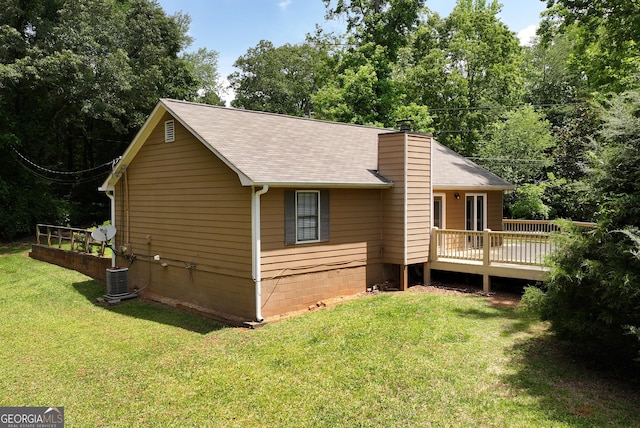 166 Walnut Cv, Dawsonville, GA 30534 - back of property with a deck, a yard, a chimney, and a shingled roof