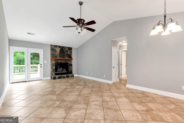 166 Walnut Cv, Dawsonville, GA 30534 - unfurnished living room with a ceiling fan, vaulted ceiling, a chandelier, a stone fireplace, and light tile patterned floors
