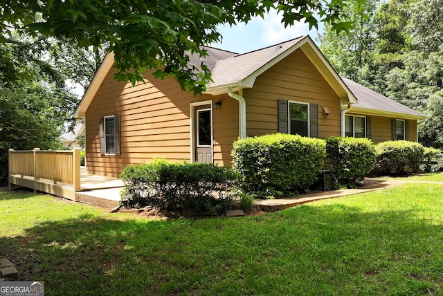 166 Walnut Cv, Dawsonville, GA 30534 - view of home's exterior featuring a deck, a yard, and roof with shingles