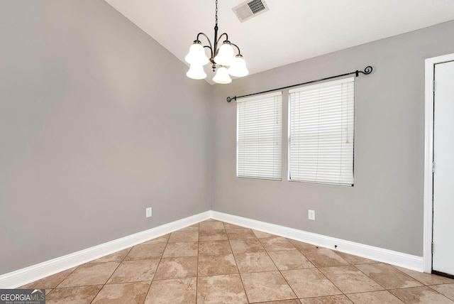166 Walnut Cv, Dawsonville, GA 30534 - spare room with a chandelier, baseboards, tile patterned flooring, and vaulted ceiling
