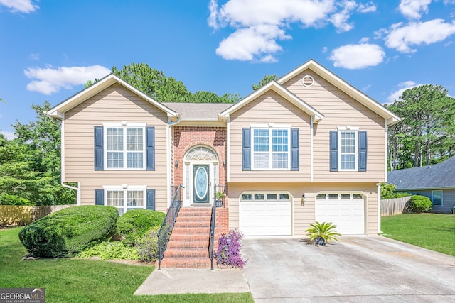 435 Flowering Trl, Grayson, GA 30017 - bi-level home with concrete driveway and a garage
