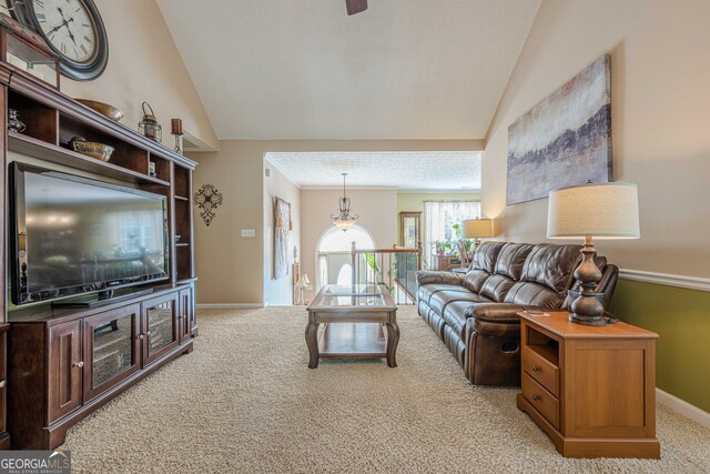 435 Flowering Trl, Grayson, GA 30017 - living area featuring lofted ceiling, light colored carpet, and baseboards