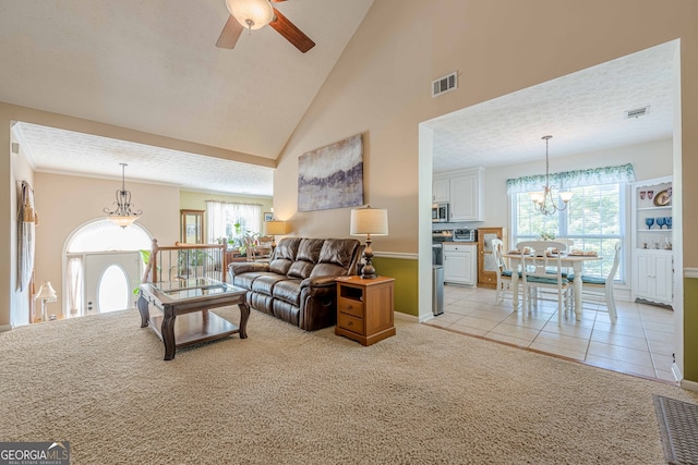 435 Flowering Trl, Grayson, GA 30017 - living room with a chandelier, light colored carpet, a ceiling fan, baseboards, and light tile patterned floors