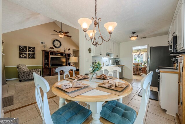 435 Flowering Trl, Grayson, GA 30017 - dining space with a chandelier, light tile patterned flooring, ceiling fan, vaulted ceiling, and a textured ceiling