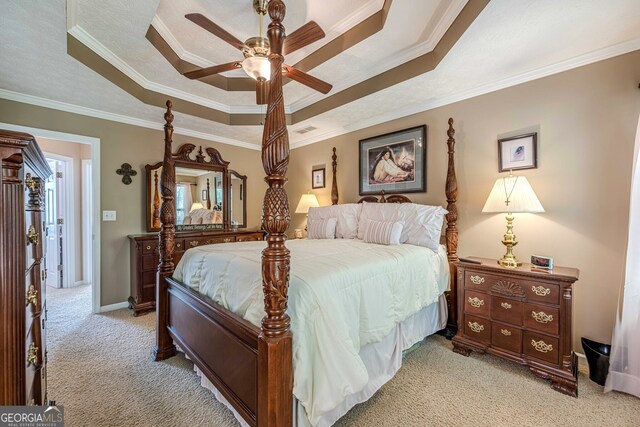 435 Flowering Trl, Grayson, GA 30017 - bedroom with a tray ceiling, light colored carpet, ornamental molding, a ceiling fan, and baseboards