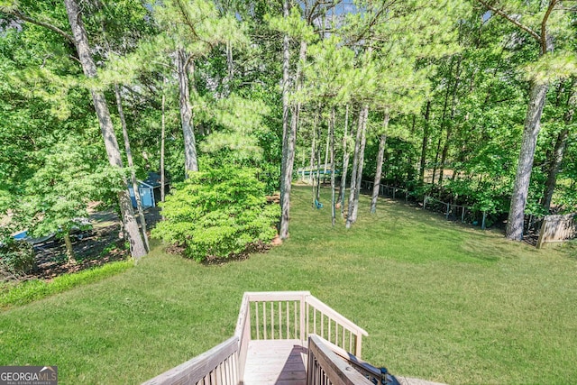 435 Flowering Trl, Grayson, GA 30017 - view of grassy yard featuring a deck