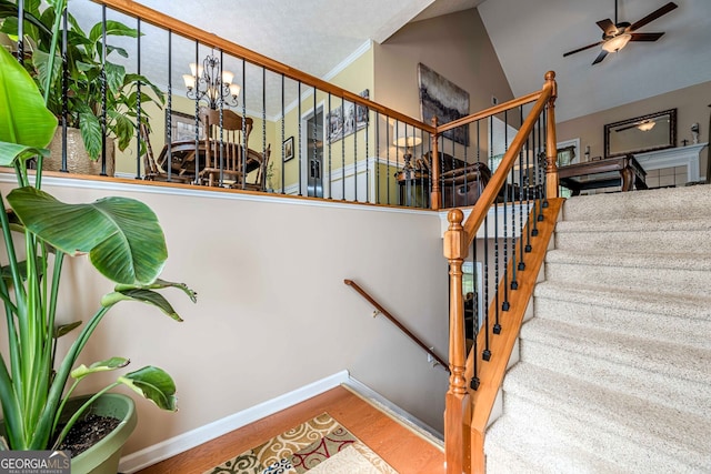 435 Flowering Trl, Grayson, GA 30017 - staircase with wood finished floors, a ceiling fan, baseboards, and vaulted ceiling