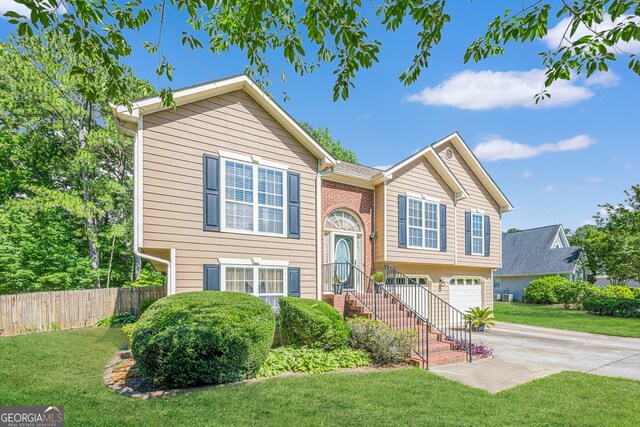 435 Flowering Trl, Grayson, GA 30017 - raised ranch featuring driveway and a garage