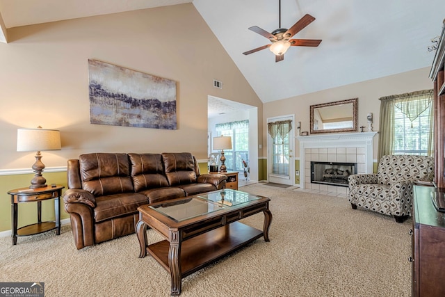 435 Flowering Trl, Grayson, GA 30017 - living room with carpet floors, high vaulted ceiling, a ceiling fan, a tile fireplace, and baseboards