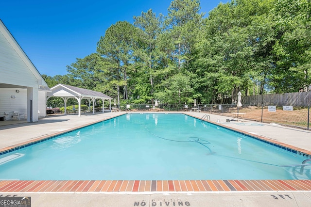 435 Flowering Trl, Grayson, GA 30017 - community pool featuring a gazebo, view of scattered trees, and a patio area
