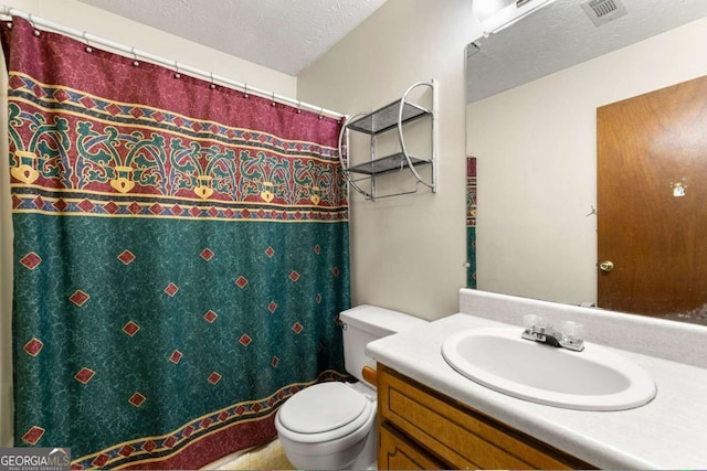 7281 Fernwood Dr, Riverdale, GA 30296 - bathroom with toilet, vanity, a shower with shower curtain, and a textured ceiling