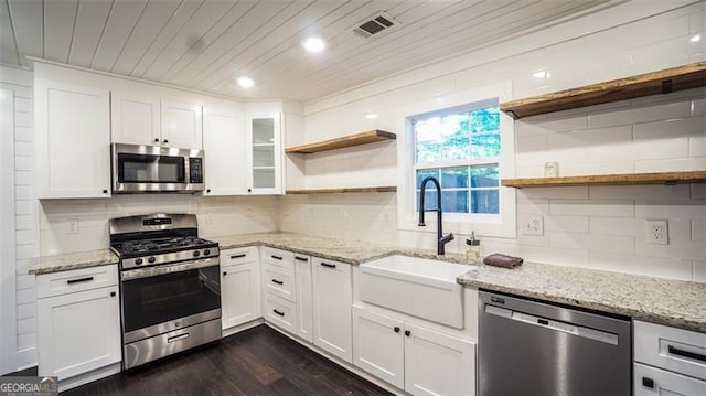 4443 Toonigh Rd, Acworth, GA 30101 - kitchen featuring open shelves, appliances with stainless steel finishes, a sink, dark wood-style floors, and white cabinetry