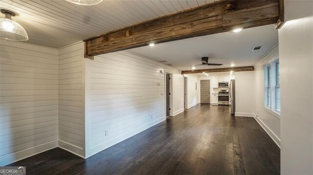 4443 Toonigh Rd, Acworth, GA 30101 - unfurnished living room featuring dark wood finished floors, wooden walls, baseboards, and ceiling fan