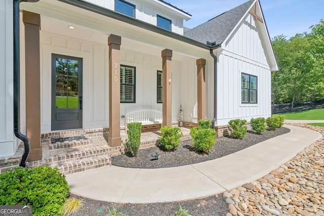 210 Birmingham Rd, Ball Ground, GA 30107 - entrance to property with board and batten siding, a porch, and roof with shingles