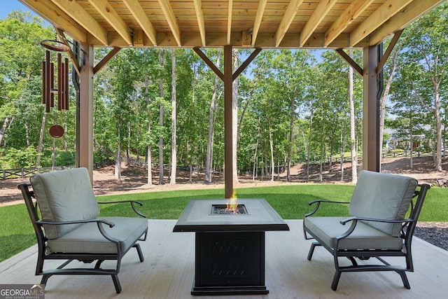 210 Birmingham Rd, Ball Ground, GA 30107 - view of patio featuring a fire pit and view of wooded area