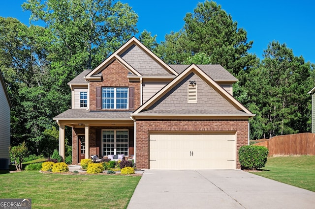3537 Edenridge Ct, Buford, GA 30519 - craftsman-style house with driveway, a garage, a porch, and brick siding