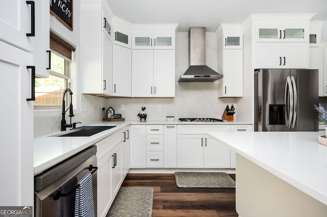 3537 Edenridge Ct, Buford, GA 30519 - kitchen featuring appliances with stainless steel finishes, wall chimney range hood, a sink, dark wood-style floors, and light countertops