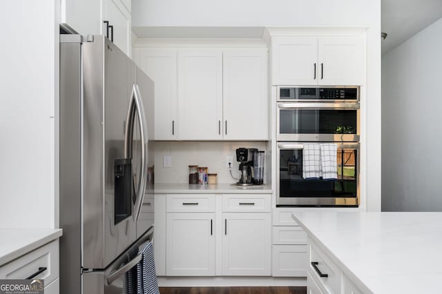 3537 Edenridge Ct, Buford, GA 30519 - kitchen with stainless steel appliances, light countertops, and white cabinets