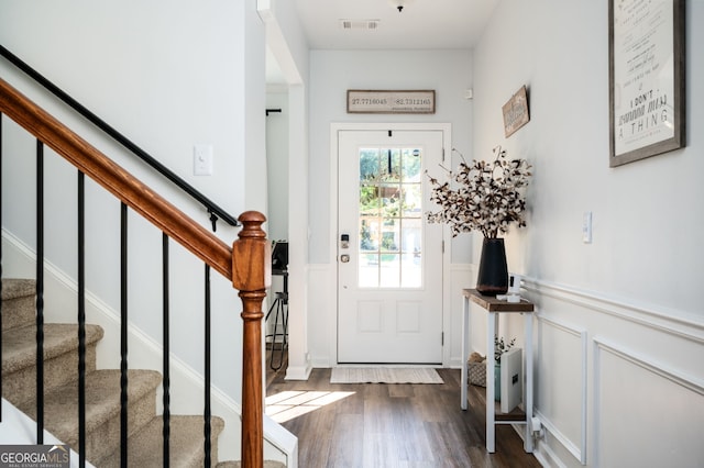 3537 Edenridge Ct, Buford, GA 30519 - foyer with dark wood-style flooring, a decorative wall, wainscoting, and stairway