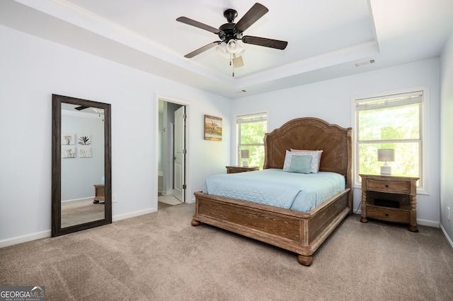 3537 Edenridge Ct, Buford, GA 30519 - bedroom featuring a tray ceiling, crown molding, light carpet, baseboards, and ceiling fan