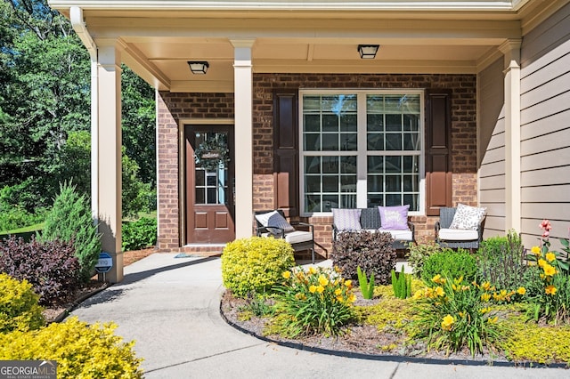3537 Edenridge Ct, Buford, GA 30519 - doorway to property featuring a porch and brick siding